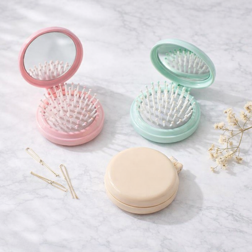 KIONCO foldable hair brush with mirror in six pastel colors